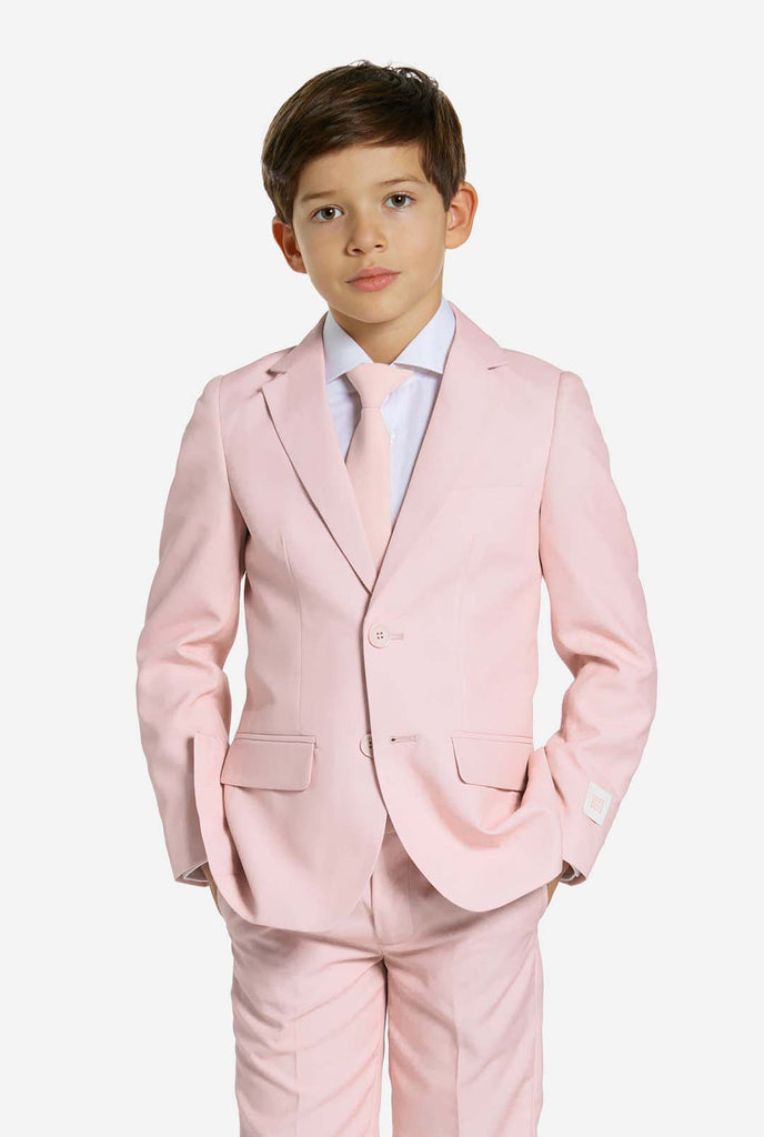 Kid wearing soft pink boys suit.