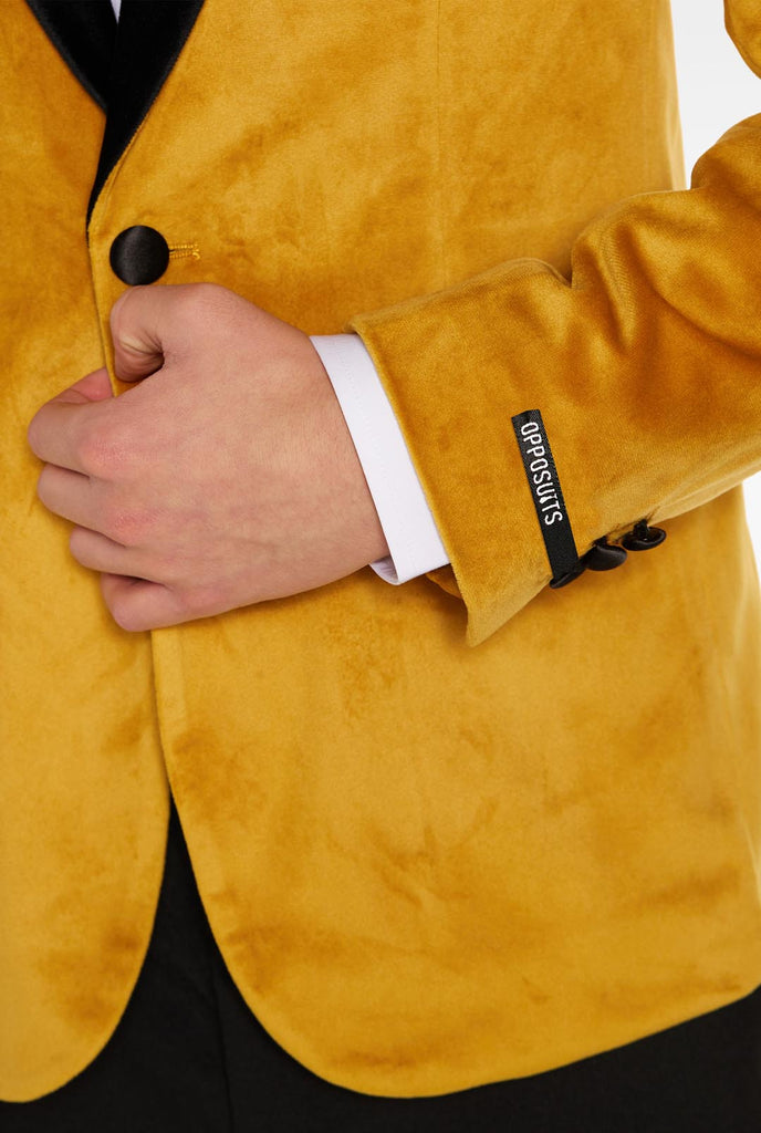 Teen wearing golden velvet dinner jacket, close up