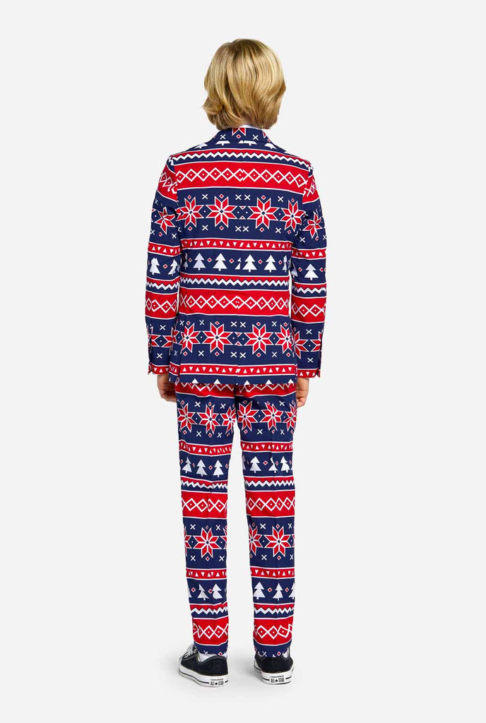 Teen wearing Christmas suit with Nordic print, view from the back