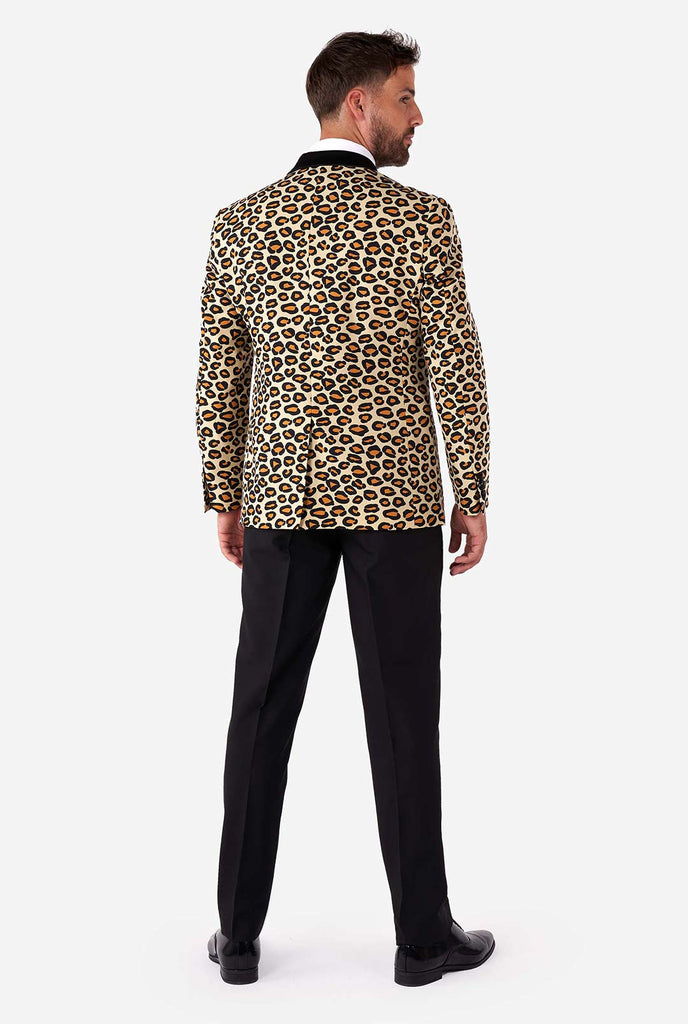 Man wearing tuxedo with jaguar print jacket