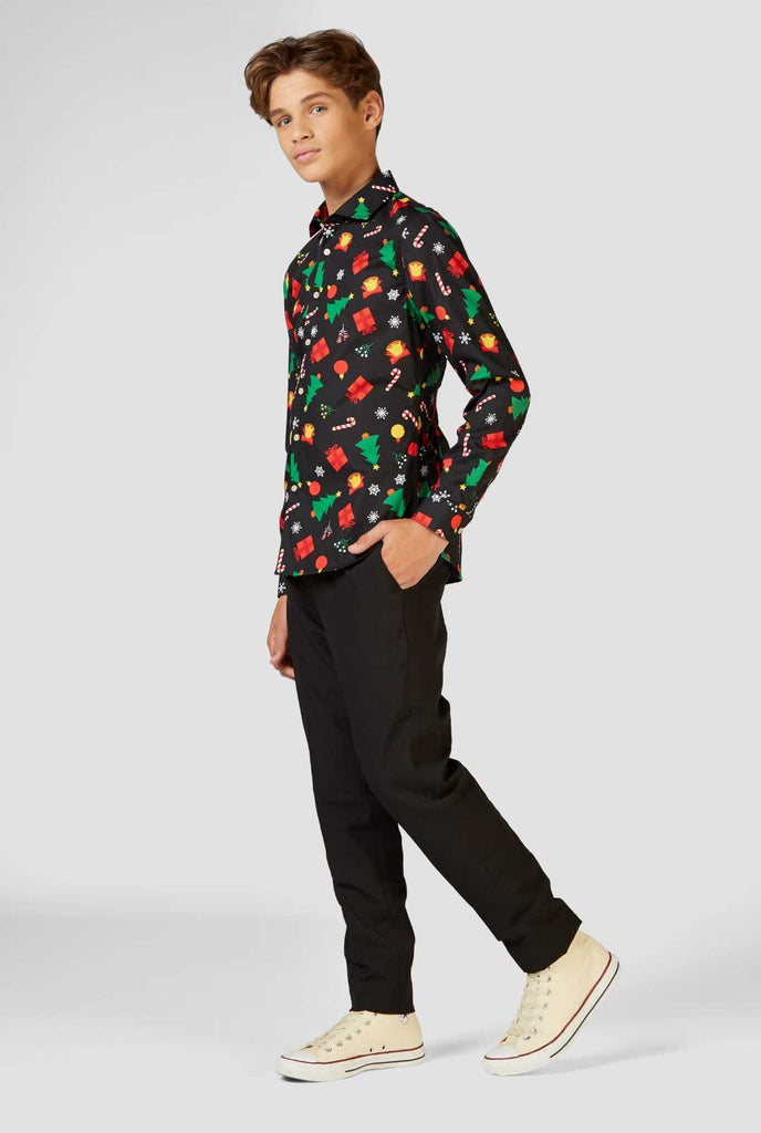 Funny black Christmas icons dress shirt worn by a teen boy view from back