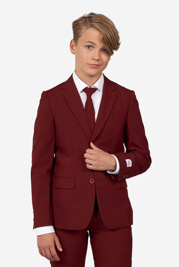 Teen wearing formal burgundy red suit