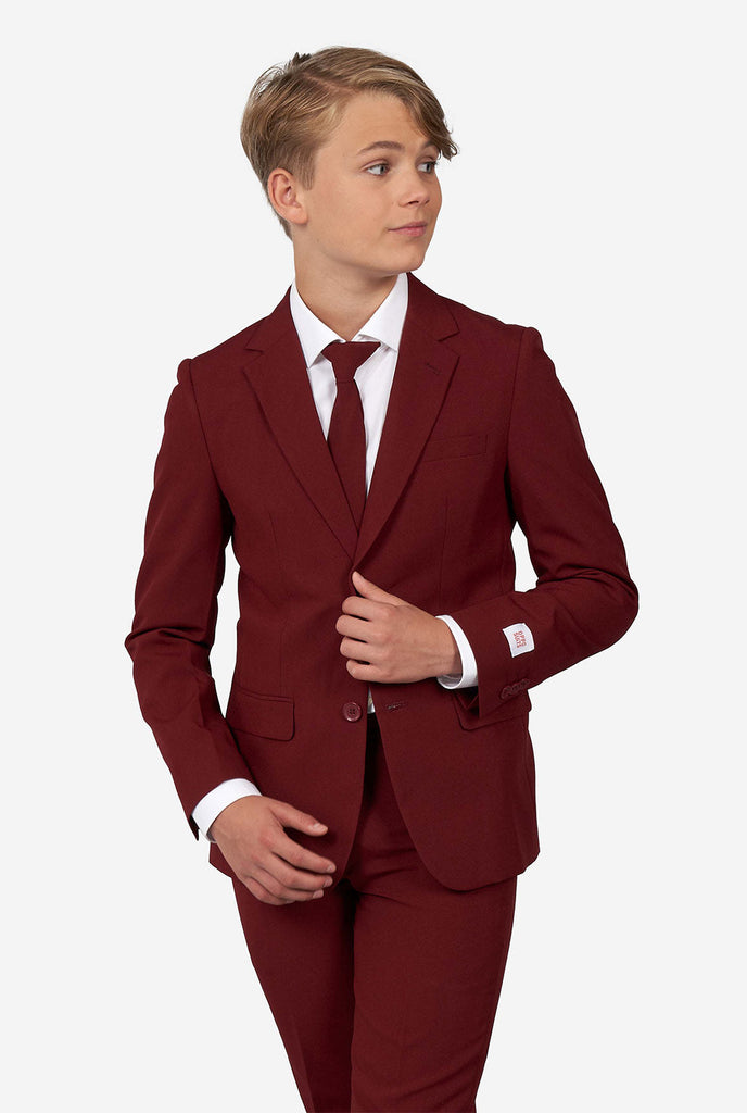 Teen wearing formal burgundy red suit