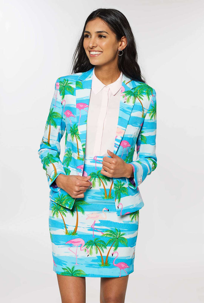 Woman wearing tropical blue suit with flamingo print