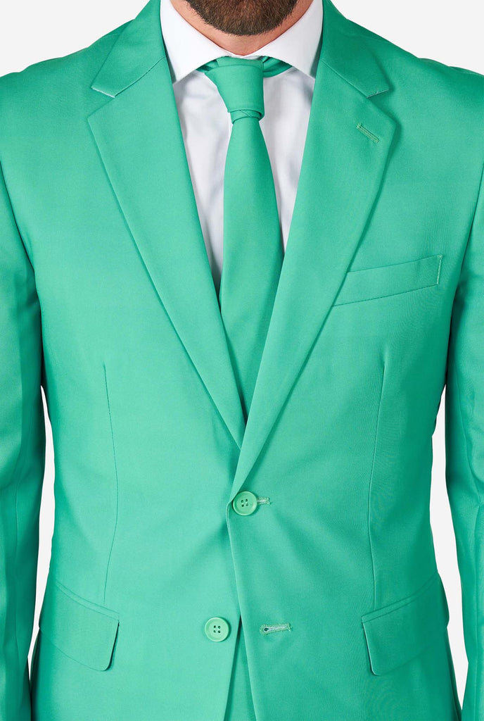 Man wearing turquoise colored suit, close up