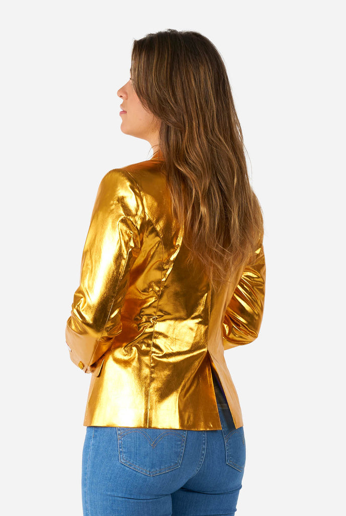 Woman wearing golden blazer, view from the back