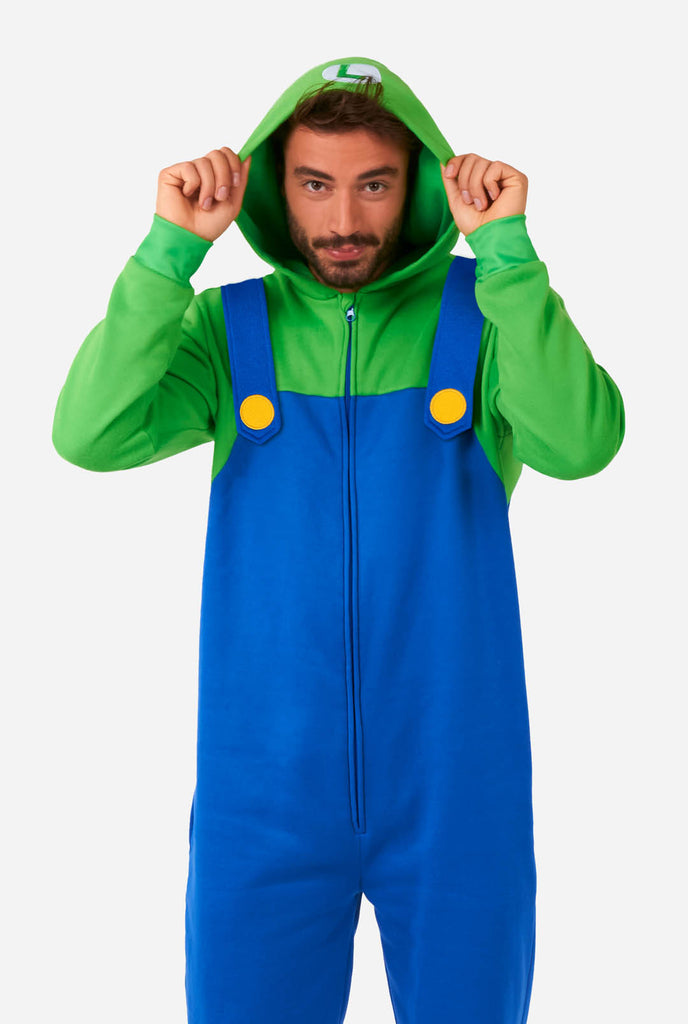 Man wearing unisex onesie with Luigi Super Mario print