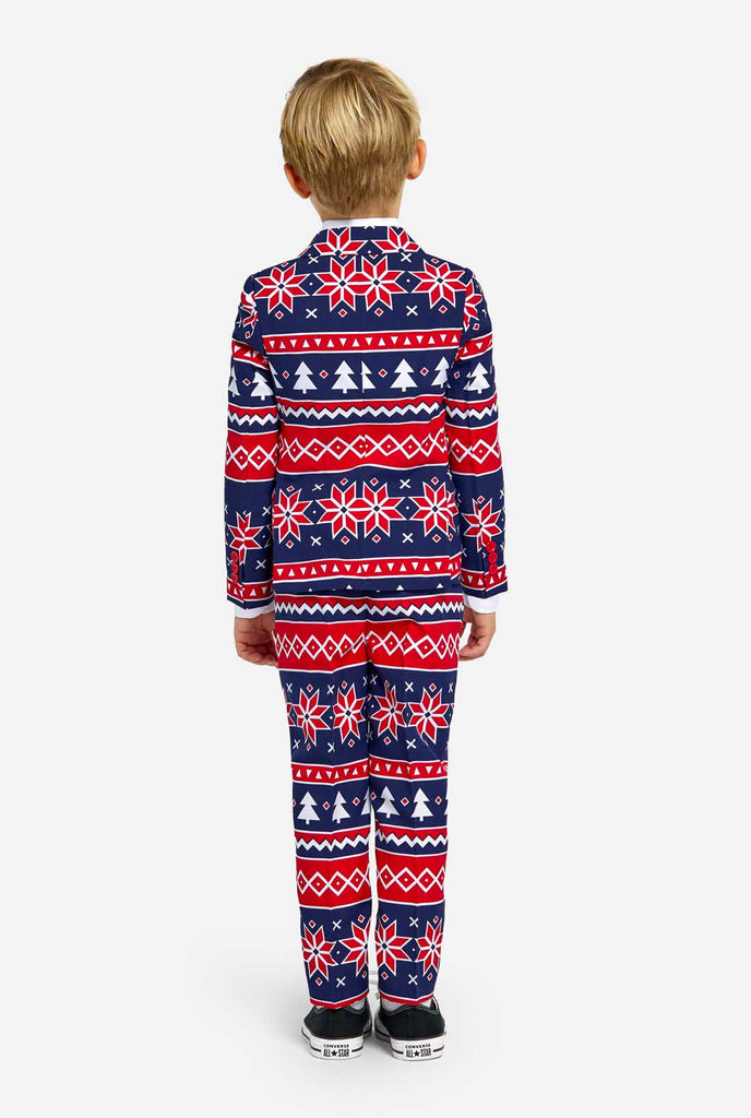 Kid wearing Christmas suit with Nordic print, view from the back