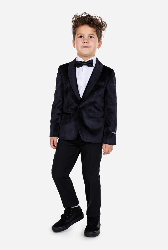Kid wearing black velvet dinner jacket for boys