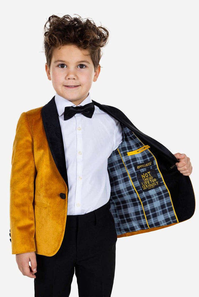 Kid wearing gold velvet dinner jacket for boys