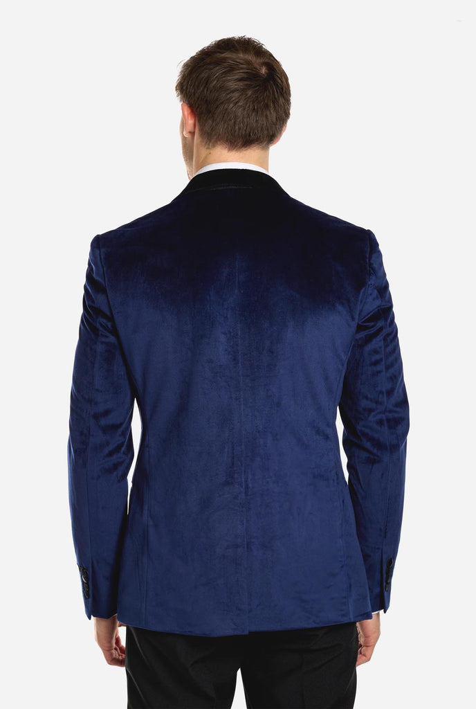 Blue velvet dinner jacket worn by man, view from the back
