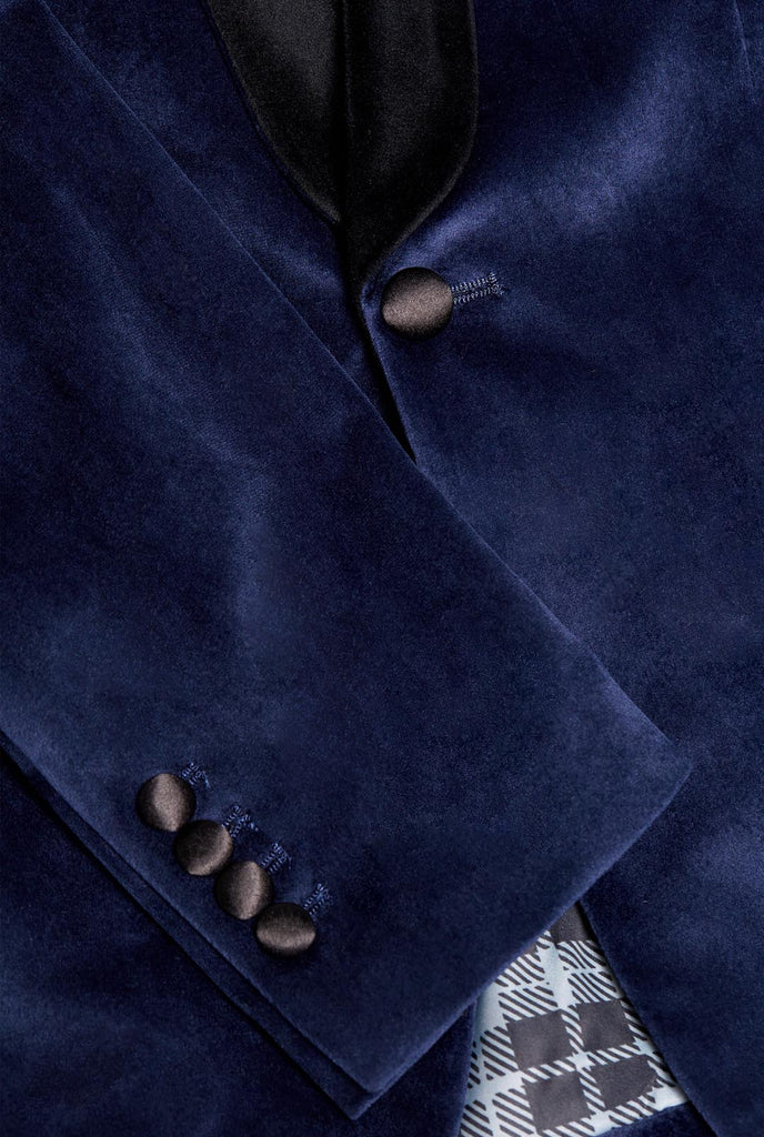 Blue velvet dinner jacket worn by man, close up