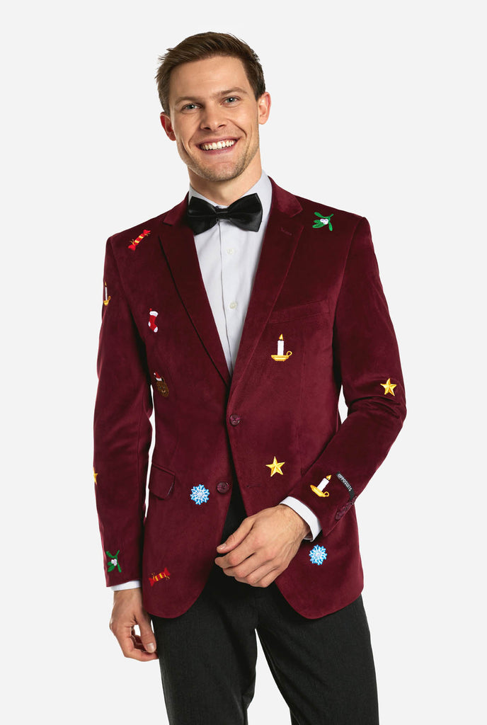 Man wearing burgundy red velvet Christmas blazer with Christmas icons