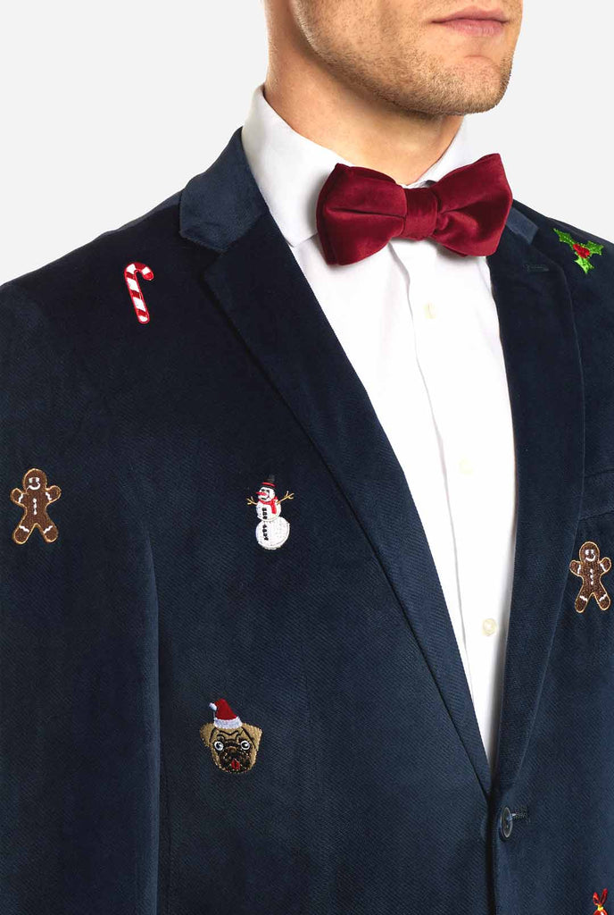 Man wearing navy blue Christmas blazer with Christmas embroidery, close up