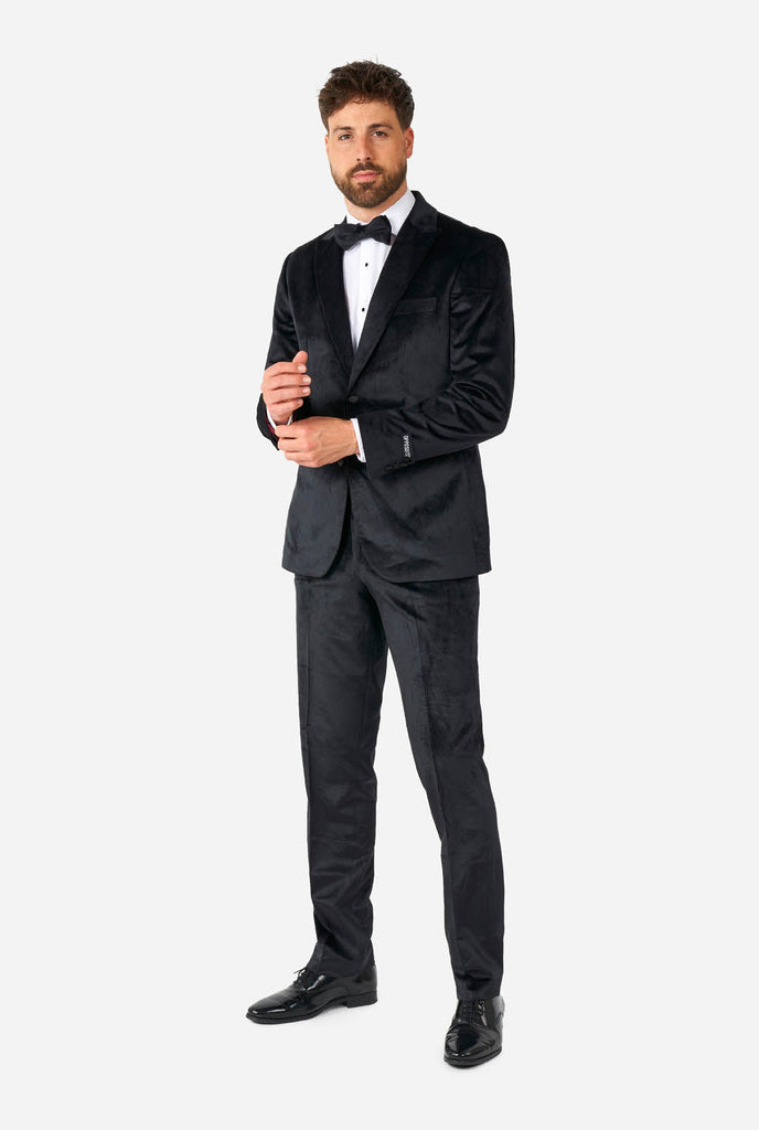 Man wearing black velvet tuxedo