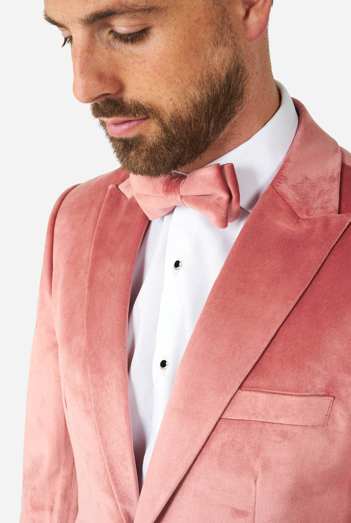 Man wearing pink velvet tuxedo, close up