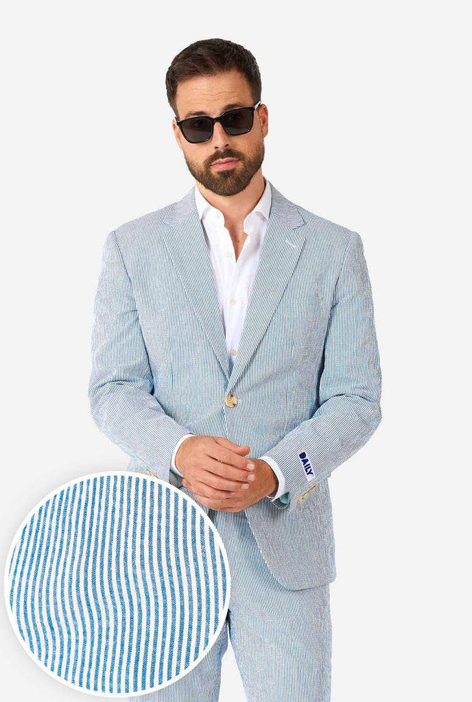 Man wearing stripped blue and white seer sucker suit