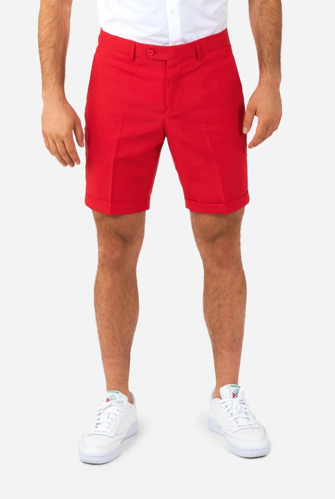 Man wearing American flag themed Summer suit, red shorts close up