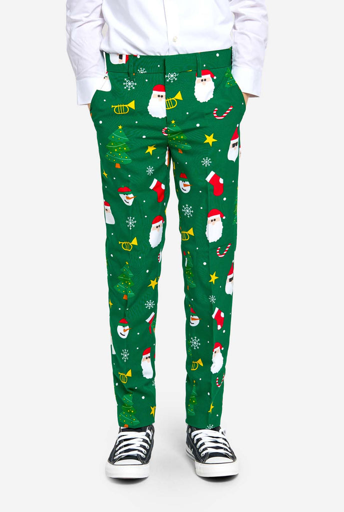 Teen wearing green Christmas suit for teens, with Christmas icons, pants view