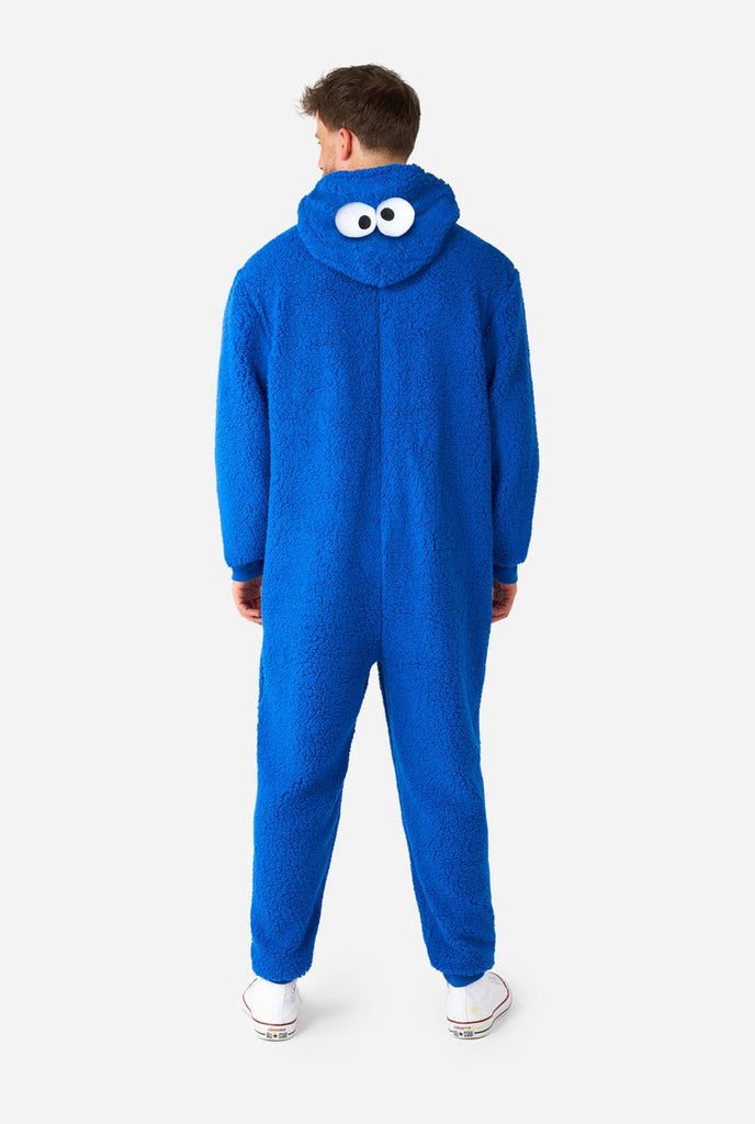 Man wearing blue pluche Cookie Monster onesie, view from the back