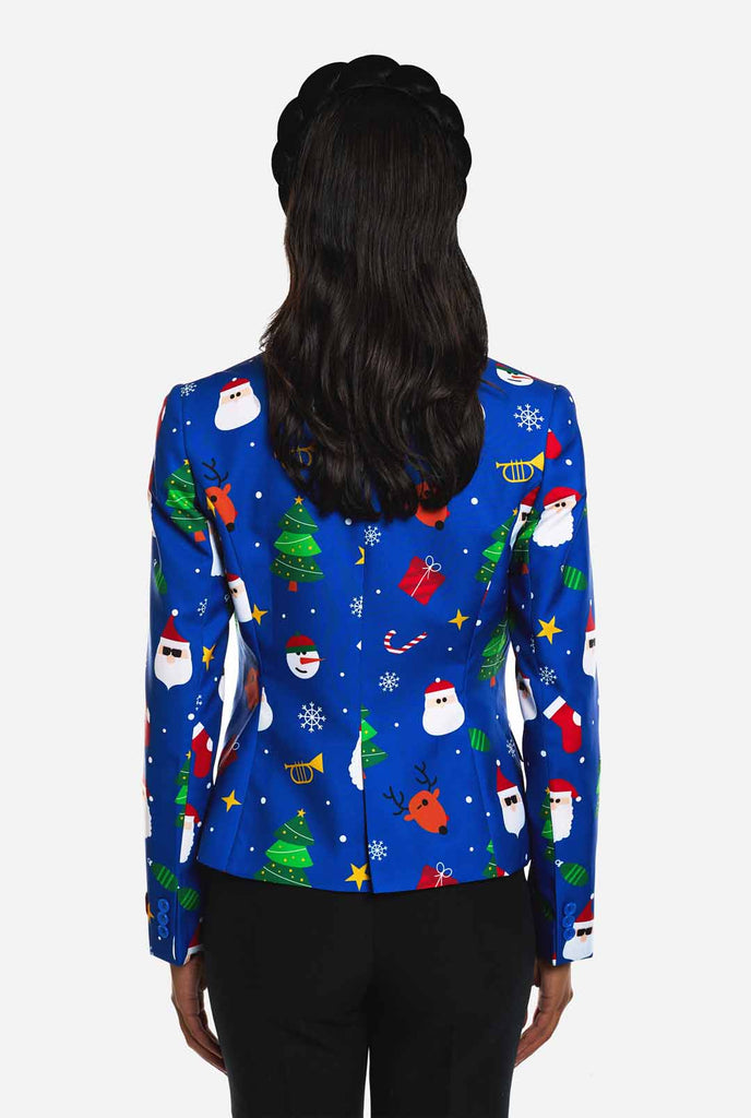 Woman wearing blue Christmas blazer for women, with Christmas icons on it. View from the back.