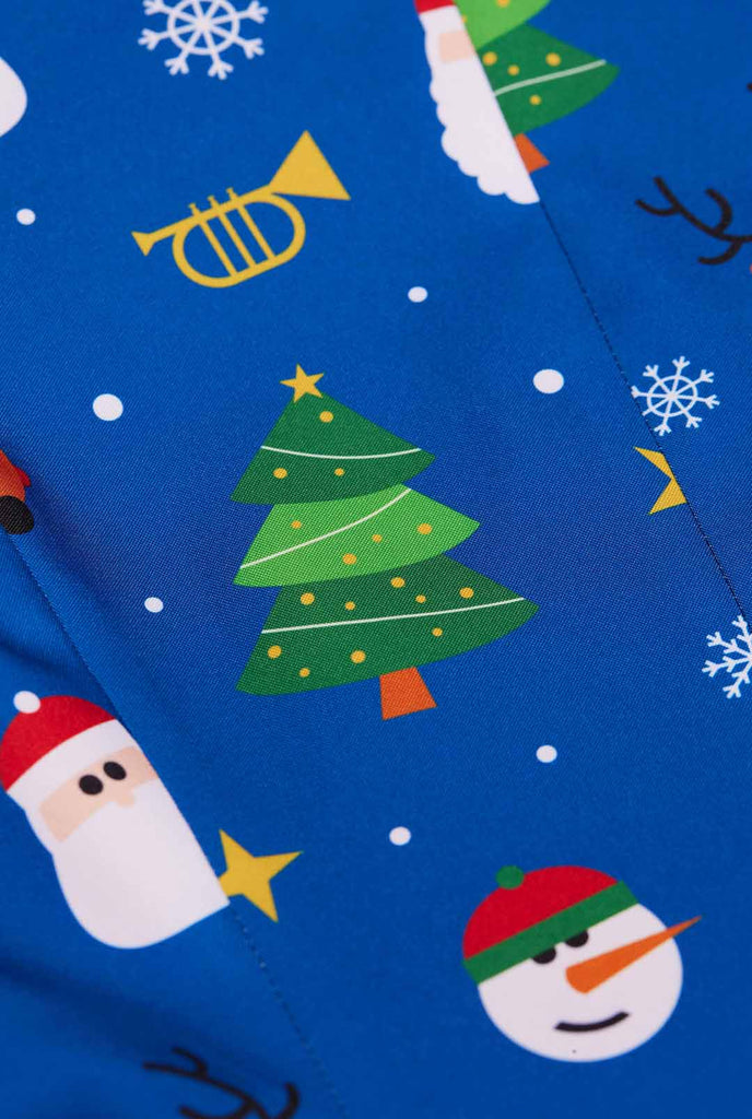 Woman wearing blue Christmas blazer for women, with Christmas icons on it. Close up.