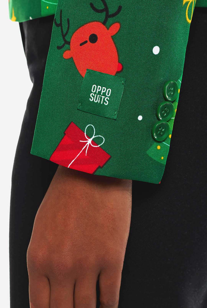 Woman wearing green Christmas blazer for women, with Christmas icons on it. Sleeve close up.