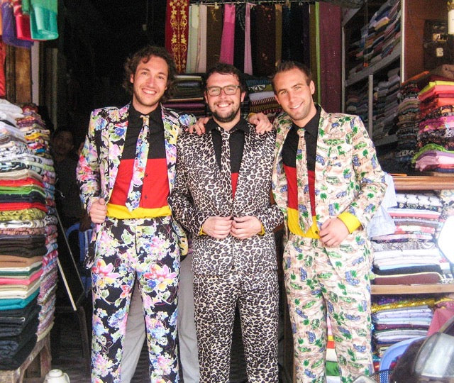 OppoSuits founders in front of fabric store