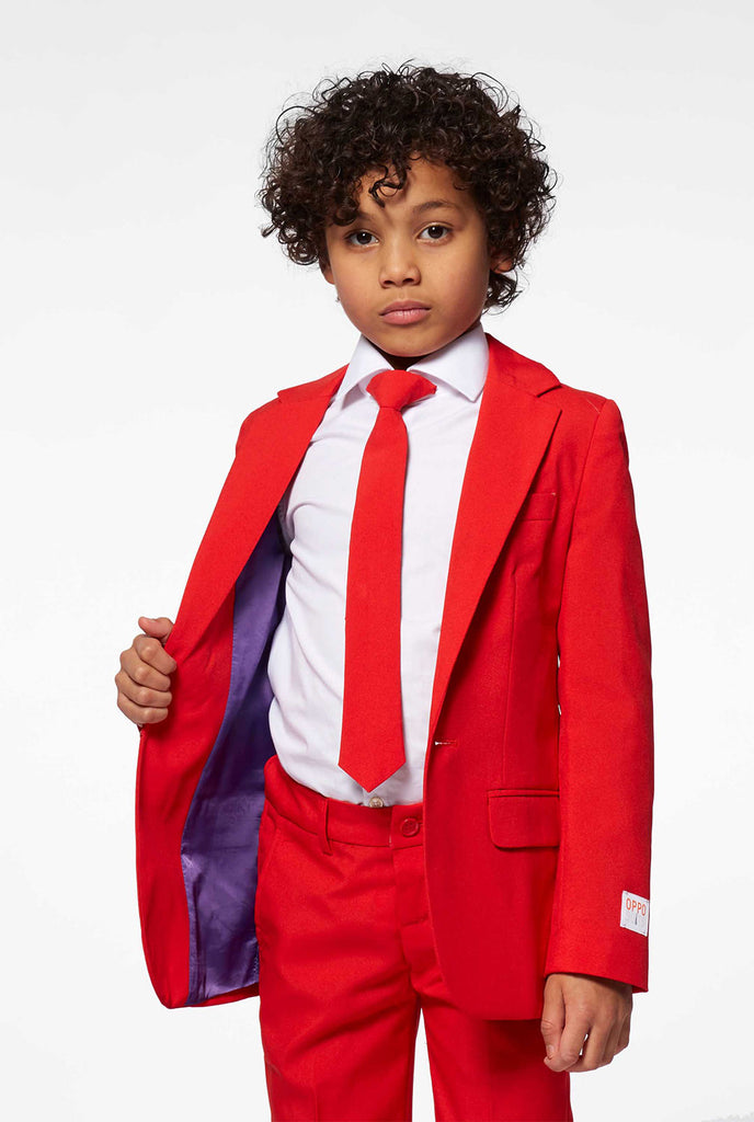 Red suit for boys worn by boy
