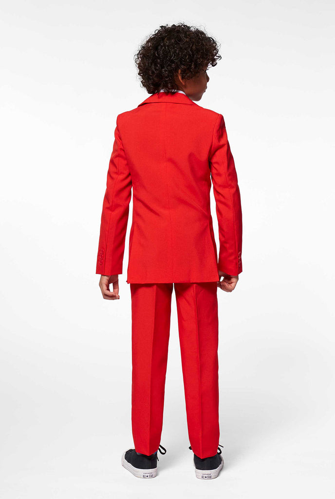 Red suit for boys worn by boy