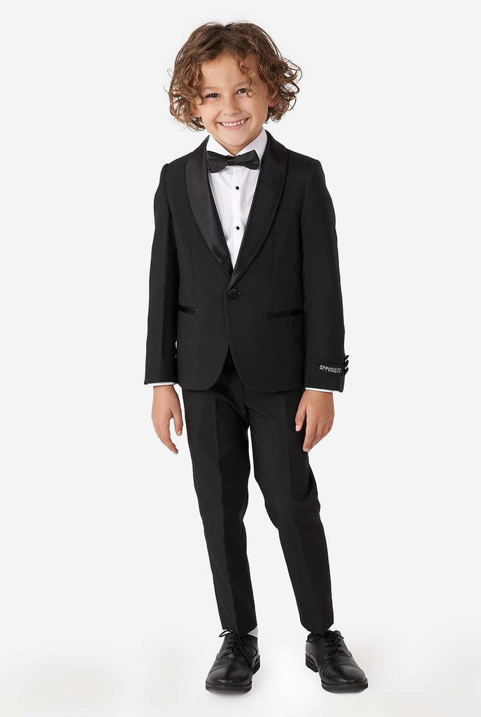 Kid wearing black tuxedo
