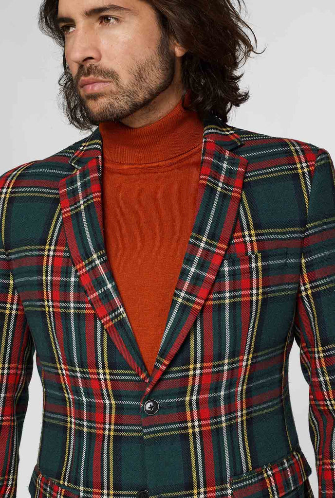 Red and green tartan blazer worn by man