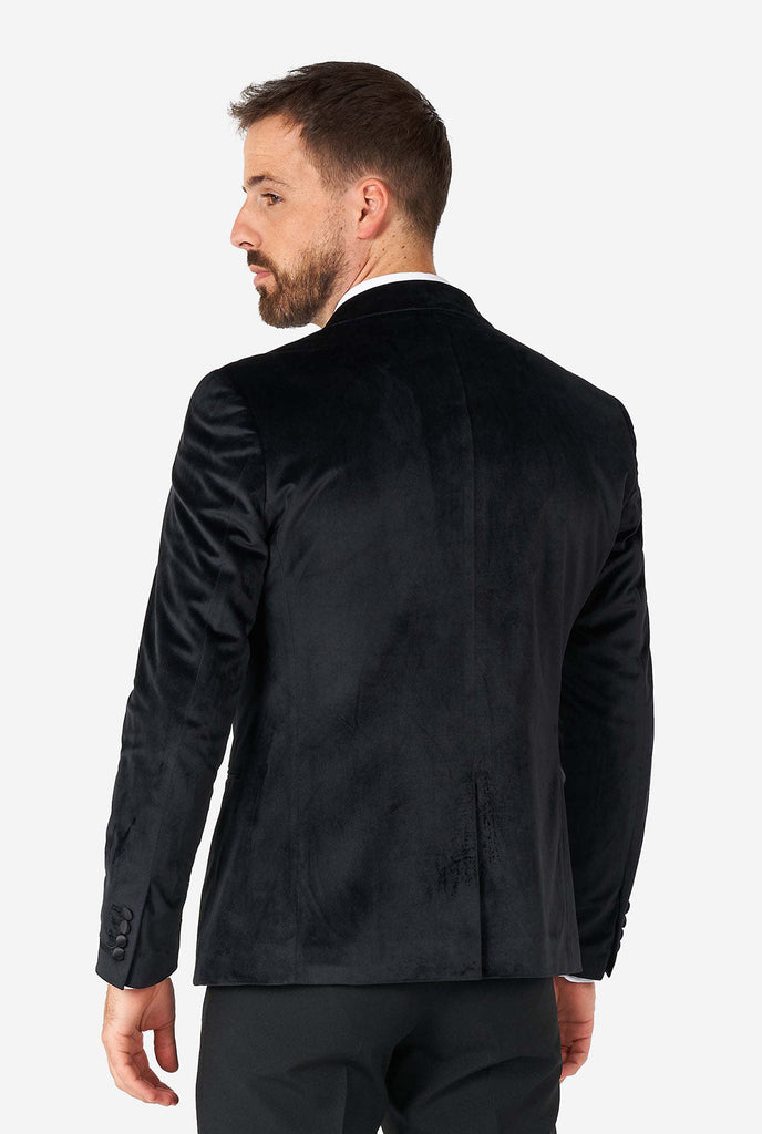 Man wearing black velvet dinner jacket blazer