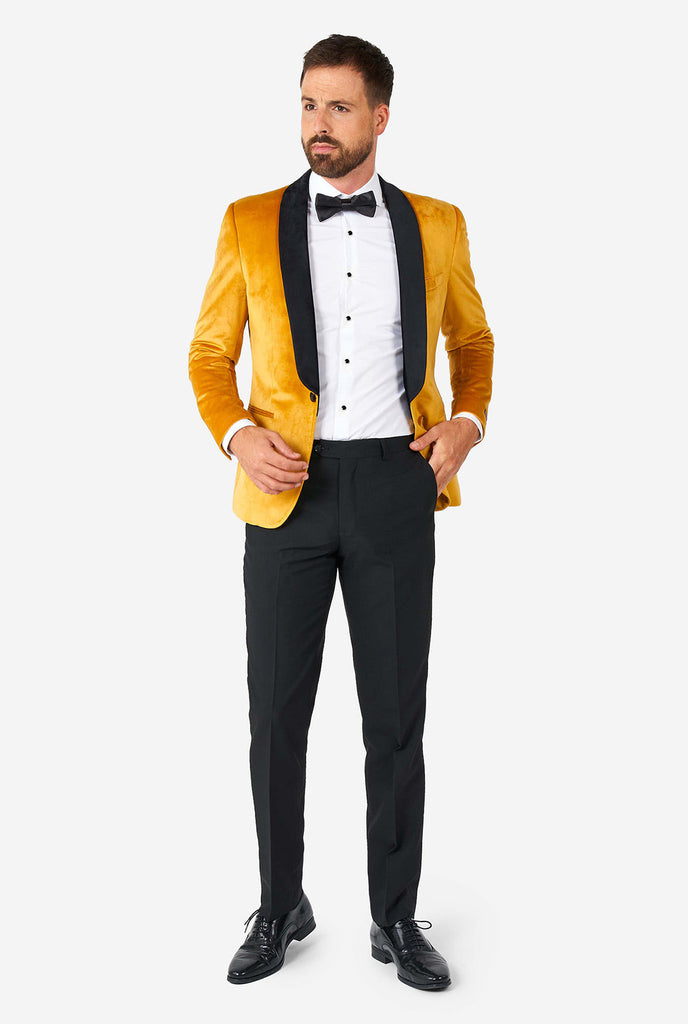 Man wearing golden velvet dinner jacket blazer