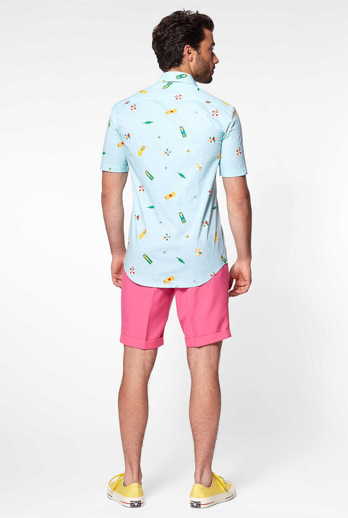 Man wearing light blue short sleeve shirt with pool icons