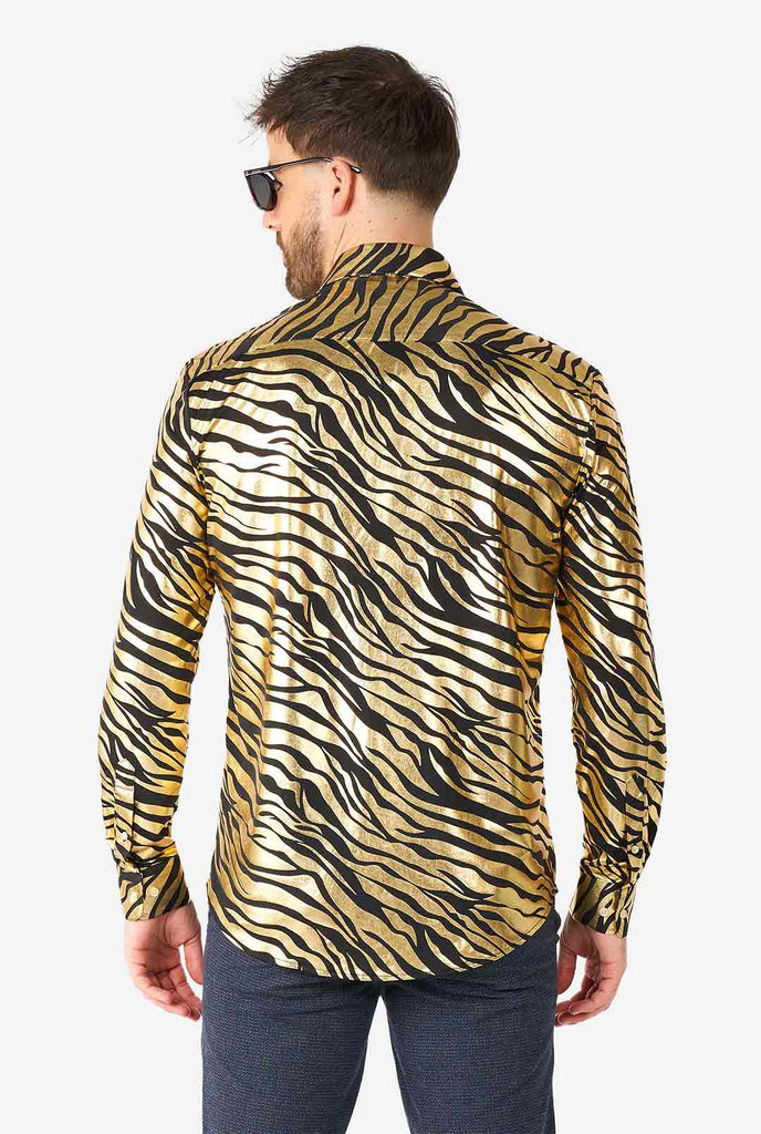 Man wearing golden dress shirt with tiger stripes