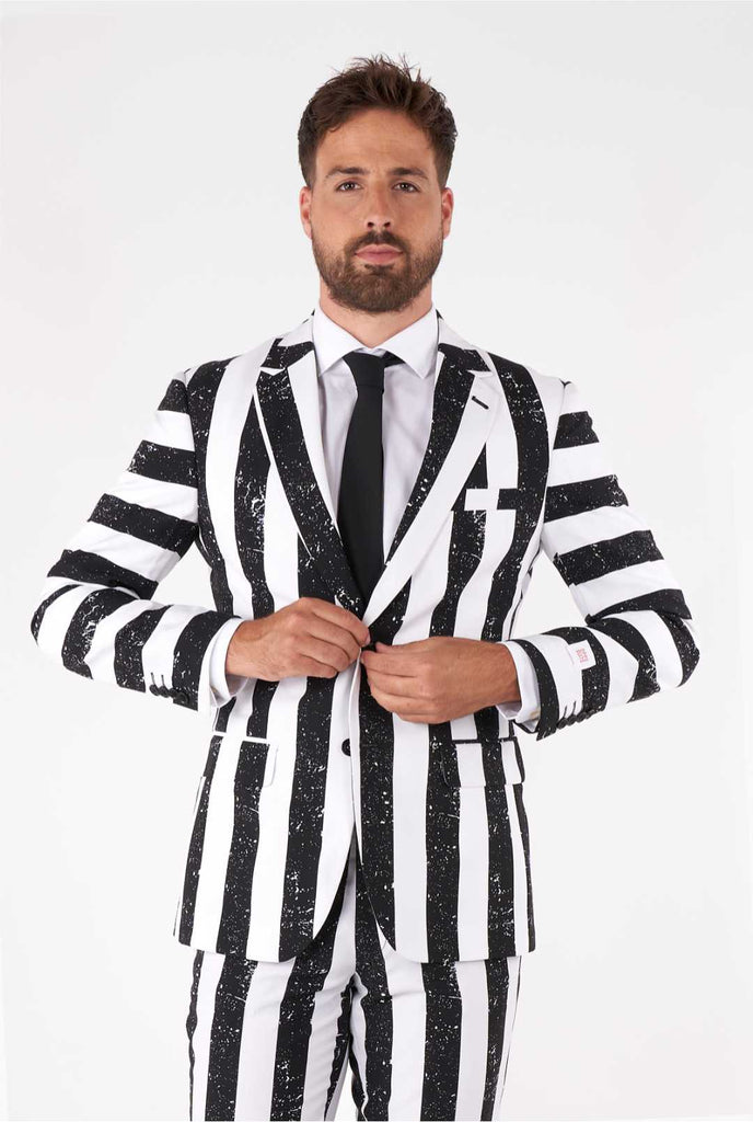 Man wearing striped black and white men's suit