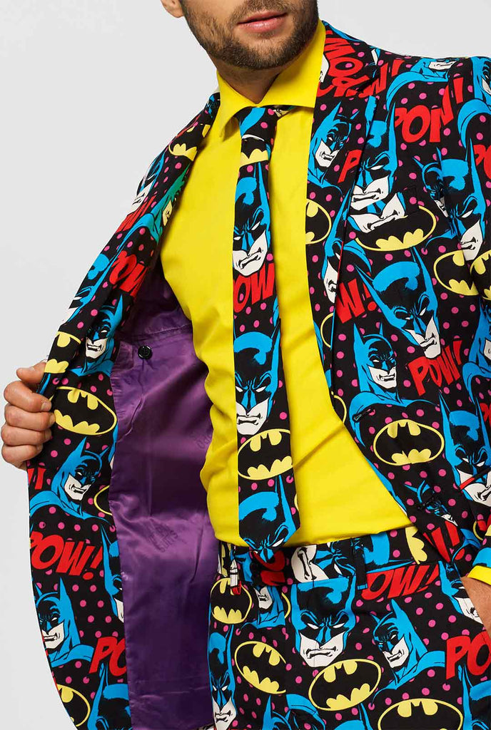 Batman themed men's suit with comic book icons worn by man