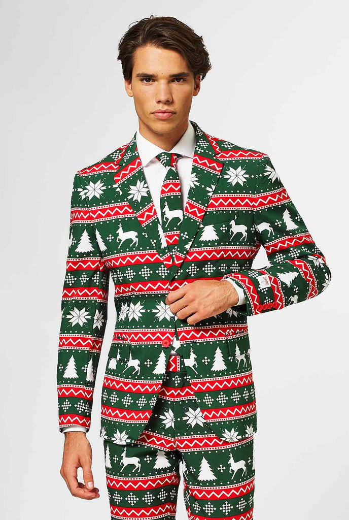 Green and red Christmas themed men's suit worn by man
