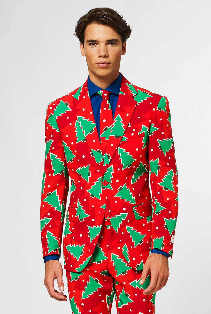 Red Christmas men's suit with pine tree print worn by man