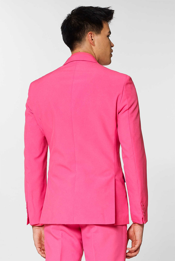 Man wearing pink men's suit with pink dress shirt