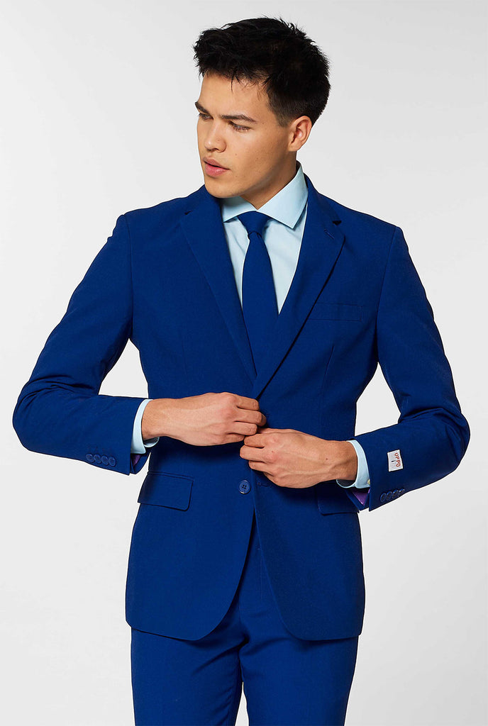 Navy blue men's suit worn by man