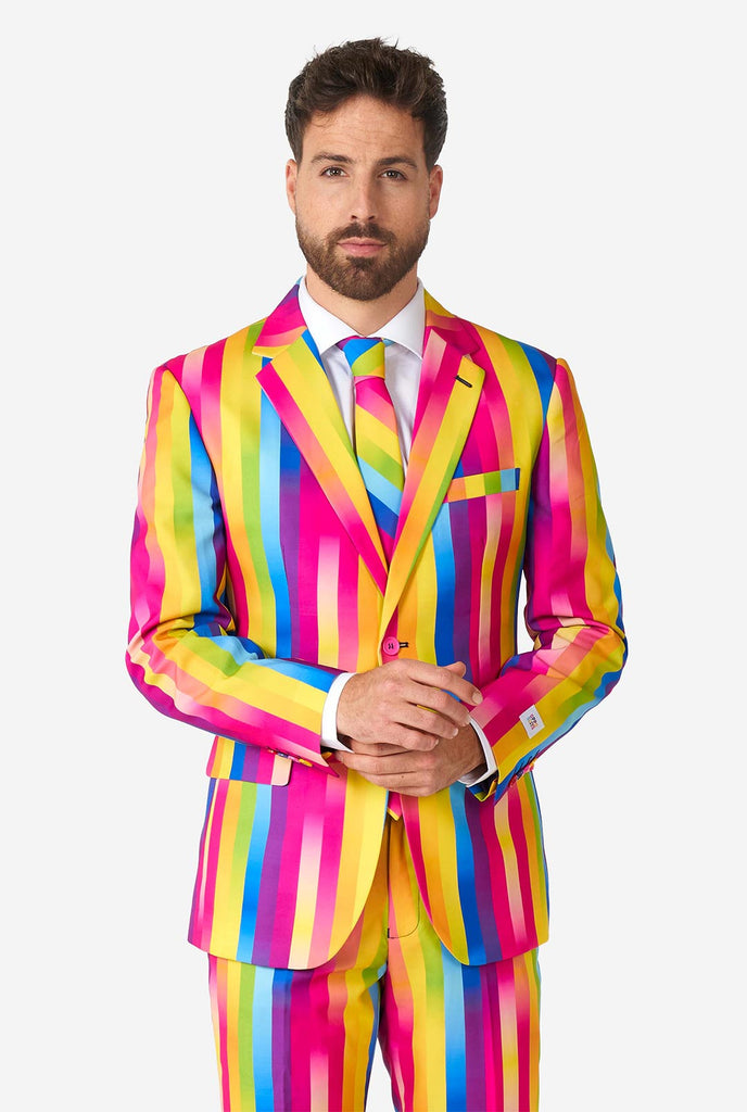 Man wearing rainbow-colored suit