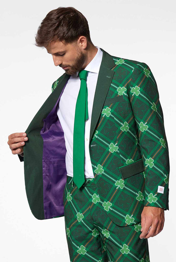 Green plaid men's suit with three-leaf-clovers worn by man