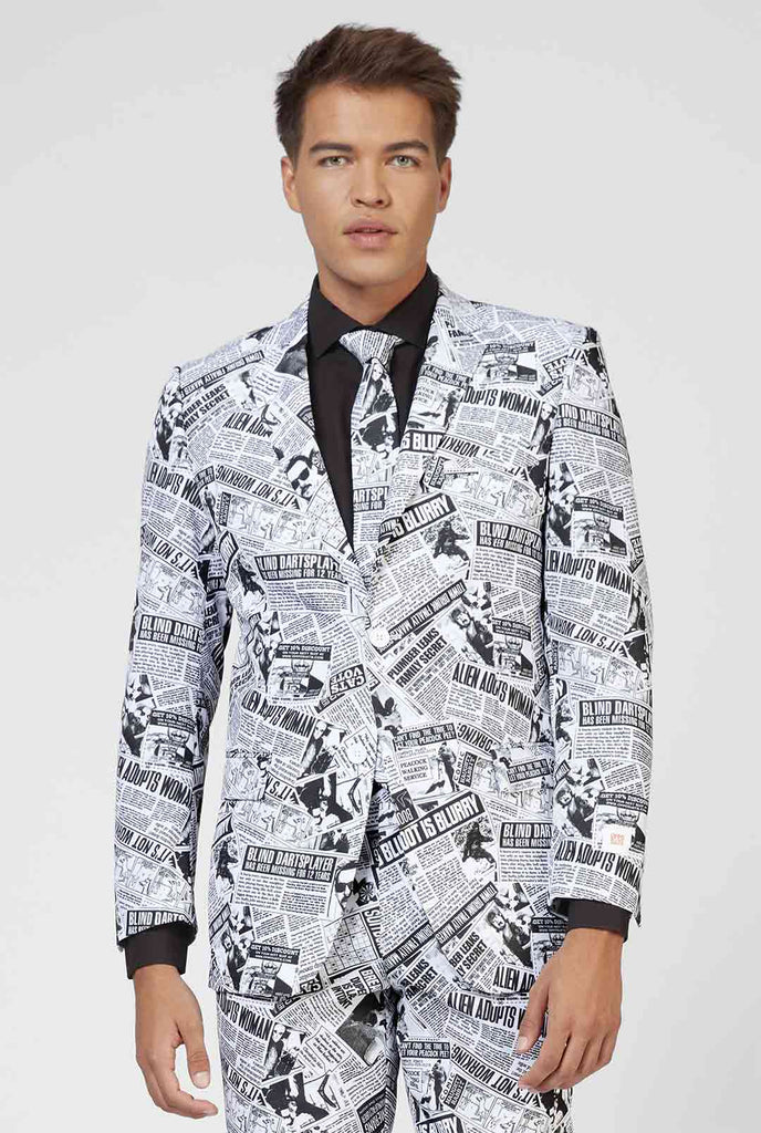 Funny newspaper print men's suit Textile Telegraph worn by man zoomed in
