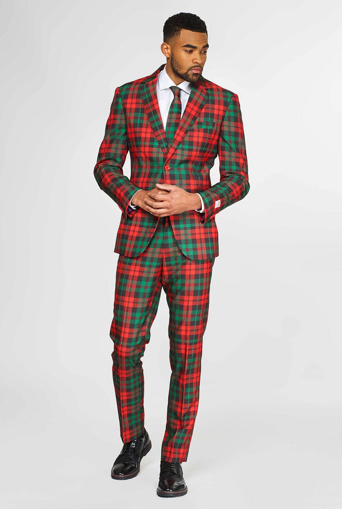 Green and red tartan Christmas suit worn by man