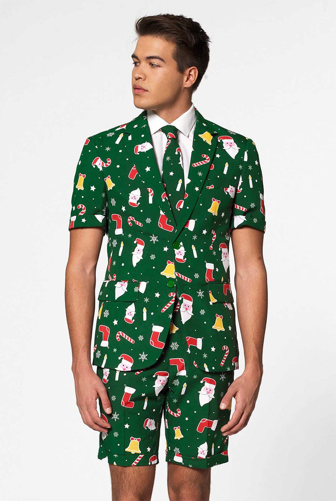Man wearing green Christmas summer suit, consisting of shorts, jacket and tie