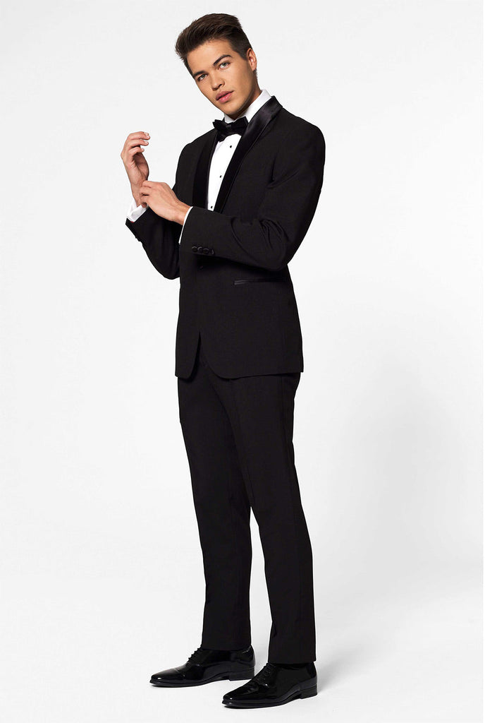 Solid black tuxedo suit Jet Set Black worn by man close up