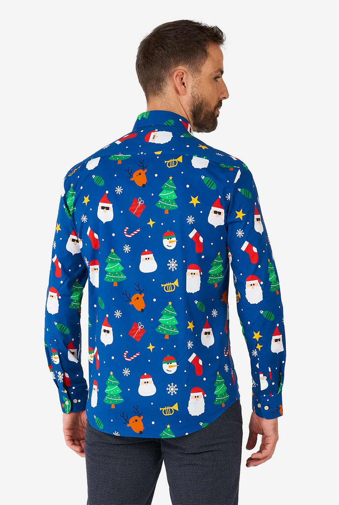 Man wearing blue Christmas dress shirt with Christmas icons