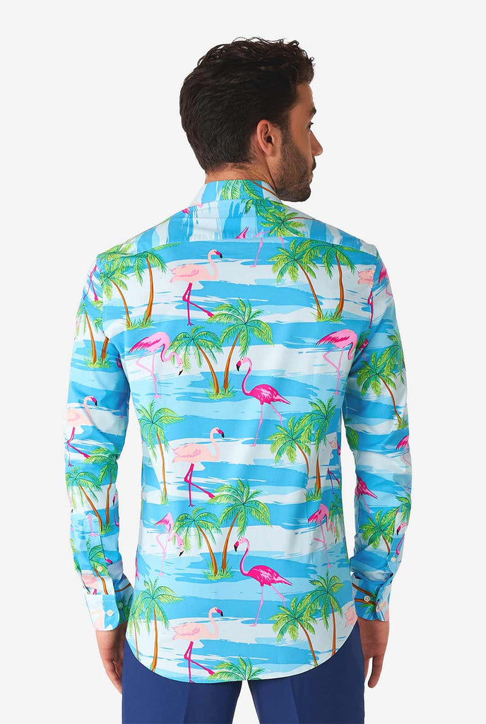 Man wearing Hawaiian dress shirt with tropical flamingo print